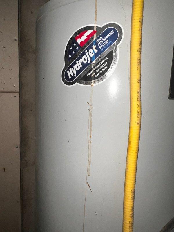 Responded to no hot water complaint and diagnosed 20-year-old gas water heater with failed gas valve stuck in closed position, preventing burner ignition. Removed and disposed of old unit, then installed new 50-gallon standard vent gas water heater with Hydrojet High Performance Energy Saver System, including new flexible gas line connection and proper venting. Tested unit operation, verified pilot light ignition, burner function, and temperature control settings to ensure proper hot water delivery.
