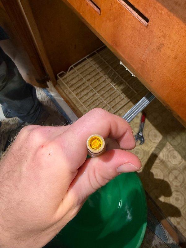 Responded to service call for kitchen sink faucet with low water pressure and slow stream. Upon inspection, identified sediment buildup in the aerator filter of the pull-down sprayer assembly. Removed, cleaned, and cleared the filter screen of debris, restoring full water pressure and flow to the faucet.