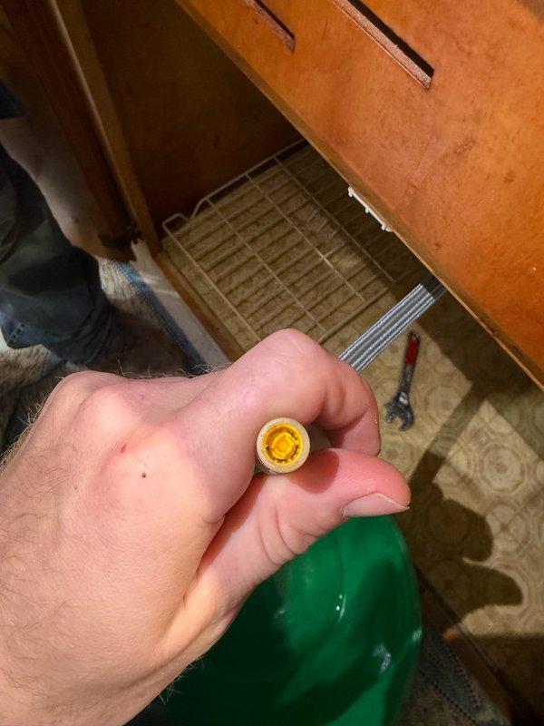 Responded to service call for kitchen sink faucet with low water pressure and slow stream. Upon inspection, identified sediment buildup in the aerator filter of the pull-down sprayer assembly. Removed, cleaned, and cleared the filter screen of debris, restoring full water pressure and flow to the faucet.
