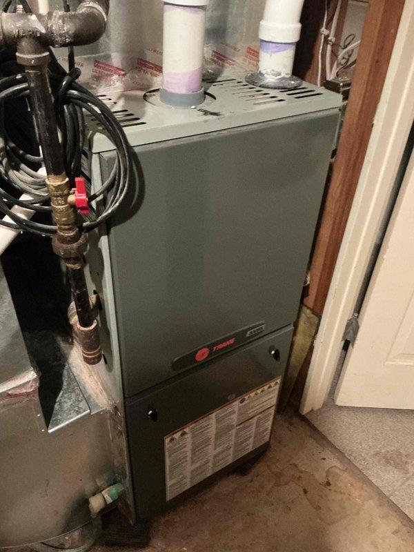 Completed annual cooling maintenance on 6-year-old Daikin central AC system and mini split unit. Central AC inspection confirmed contactor, capacitor, refrigerant charge, and amp draws all within specifications; condenser and evaporator coils clean; temperature drop measured at 20 degrees. Mini split system operating properly with 25-degree temperature drop. Replaced furnace filter during inspection. Critical finding: discovered cracked heat exchanger in 15-year-old furnace; recommended full furnace replacement due to age and safety concerns, with part quote to follow for customer consideration.