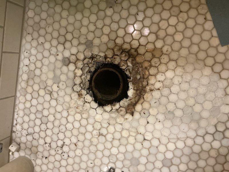 Responded to service call for leaking toilet. Upon inspection, identified that the cast iron toilet flange was installed too high, preventing proper seal and causing water leakage around the base. Removed the existing cast iron flange and installed a cast iron repair flange at the correct height to ensure proper toilet mounting and watertight seal. Leak resolved and toilet restored to normal operation.