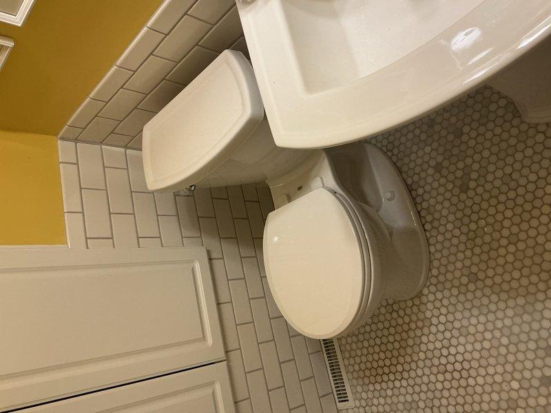 Responded to service call for leaking toilet. Upon inspection, identified that the cast iron toilet flange was installed too high, preventing proper seal and causing water leakage around the base. Removed the existing cast iron flange and installed a cast iron repair flange at the correct height to ensure proper toilet mounting and watertight seal. Leak resolved and toilet restored to normal operation.