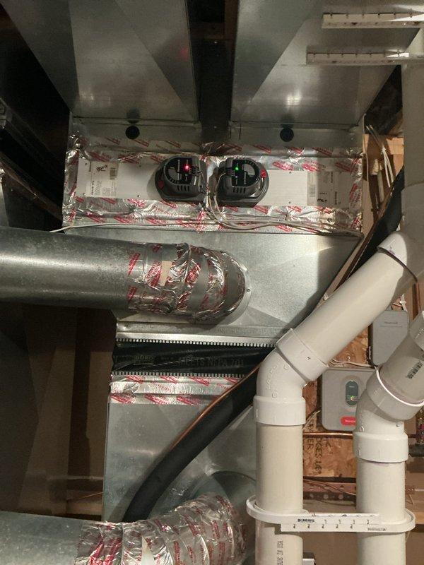 Completed annual cooling maintenance on 9-year-old air conditioning system. Replaced failing capacitor, outdoor temperature sensor batteries, and malfunctioning main level zone thermostat that was causing continuous fan operation when system was off. Verified all other components operating within specifications with proper refrigerant levels and system confirmed operational upon completion.