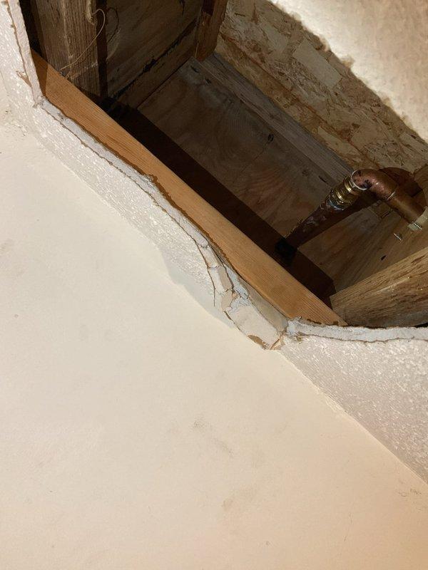 Accessed crawl space through floor opening to inspect and address plumbing concerns. Evaluated exposed copper piping running between floor joists and assessed structural framing conditions. Completed minor repair work on plumbing system and documented existing conditions of access point and surrounding infrastructure for customer records.