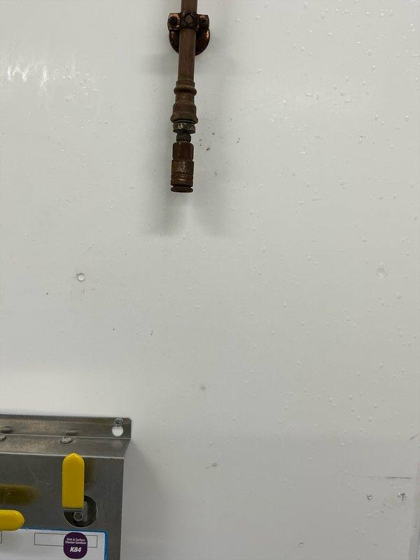 Removed fittings from two existing pipes and successfully capped four air lines in the mechanical utility area. The work involved disconnecting aged copper piping components and properly sealing the air line connections to prevent leaks and maintain system integrity.