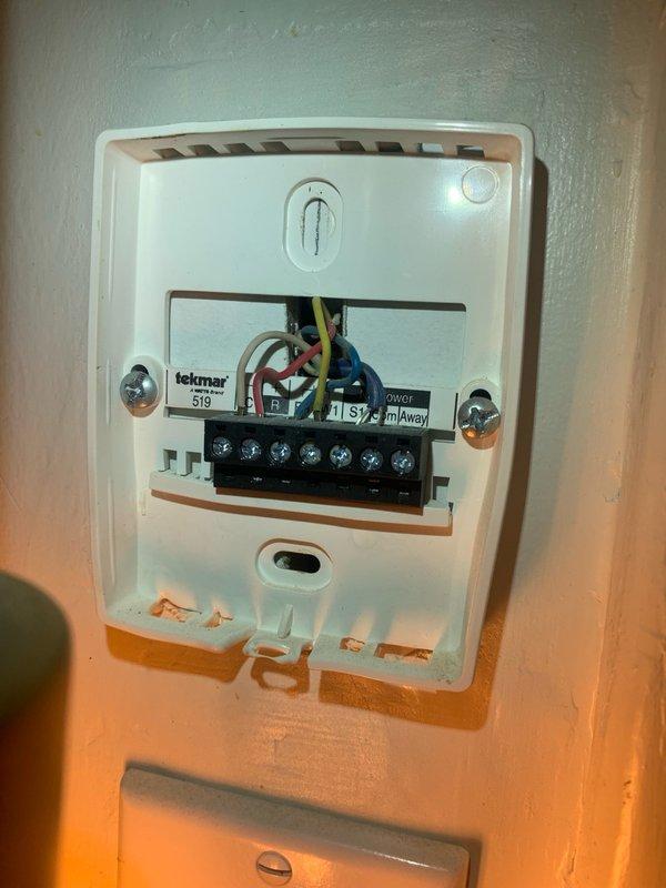 Responded to service call for Navien tankless water heater system experiencing operational issues due to faulty factory transformer. Retrieved correct replacement transformer and returned to site to complete repair. Removed defective transformer from boiler unit and installed new factory-spec replacement component. Following installation, performed comprehensive system testing including cycling all heating zones and verifying domestic hot water functionality. Confirmed all zones responded properly and system returned to normal operation with proper voltage readings and no error codes displayed on control panel.