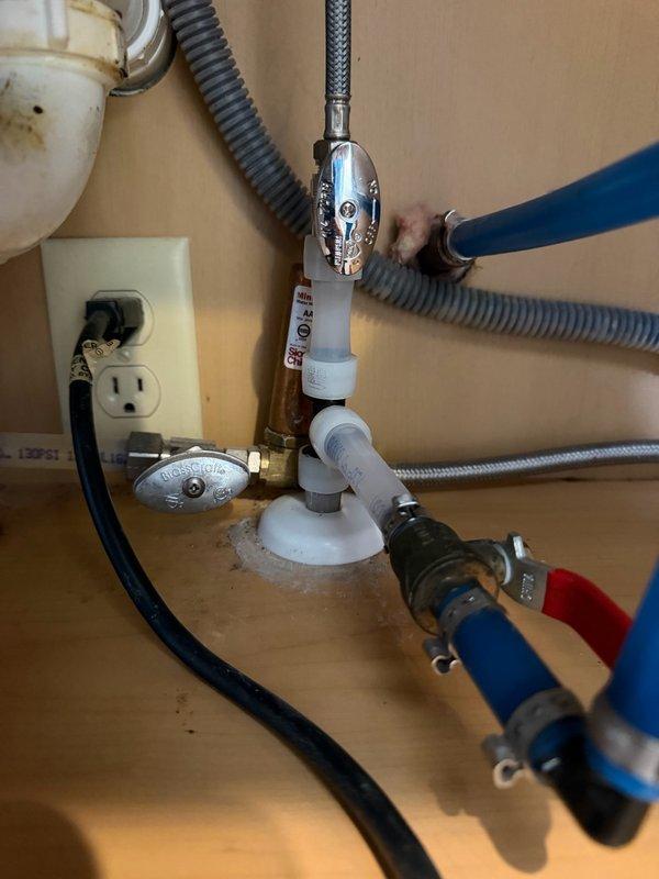 Responded to a slow water leak located under the kitchen sink. Upon inspection, identified a faulty compression angle stop valve on the hot water line that was causing visible corrosion on the copper piping. Replaced the defective angle stop valve and removed and reinstalled the affected section of copper pipe to eliminate the leak and prevent further corrosion damage to the plumbing system.