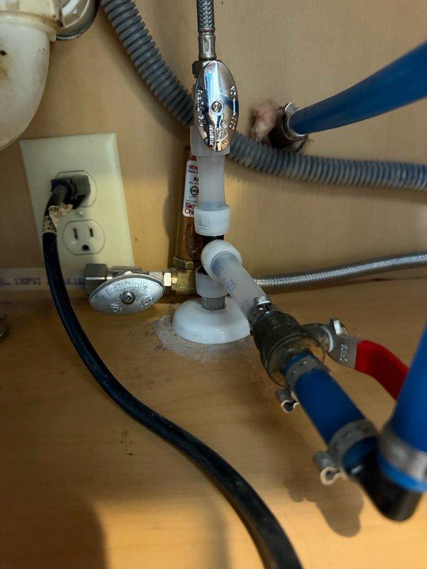 Responded to a slow water leak located under the kitchen sink. Upon inspection, identified a faulty compression angle stop valve on the hot water line that was causing visible corrosion on the copper piping. Replaced the defective angle stop valve and removed and reinstalled the affected section of copper pipe to eliminate the leak and prevent further corrosion damage to the plumbing system.