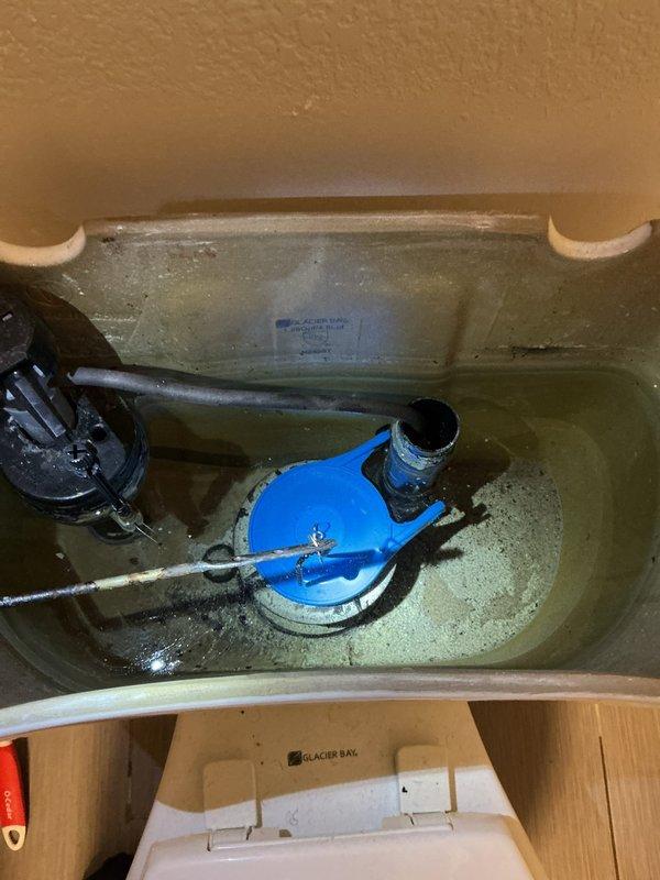 Responded to a municipal notice regarding excessive water consumption at approximately 3 gallons per hour. Conducted a comprehensive inspection of all interior water lines and plumbing fixtures throughout the residence to identify the source of continuous water loss.

**Diagnostic Findings:**

Performed systematic evaluation of all water supply lines with no visible leaks detected in accessible piping. Inspected all plumbing fixtures and identified two problem areas in the basement level. The basement shower valve exhibited a slow drip, determined to be insufficient to account for the reported water usage rate. The basement toilet was found to be the primary source of water loss, with the flapper valve failing to maintain a proper seal, causing the fill valve to cycle and refill the tank approximately every 10 minutes.

**Work Performed:**

Removed and replaced the defective shower valve assembly in the basement shower. Tested the new valve installation for proper operation and verifie