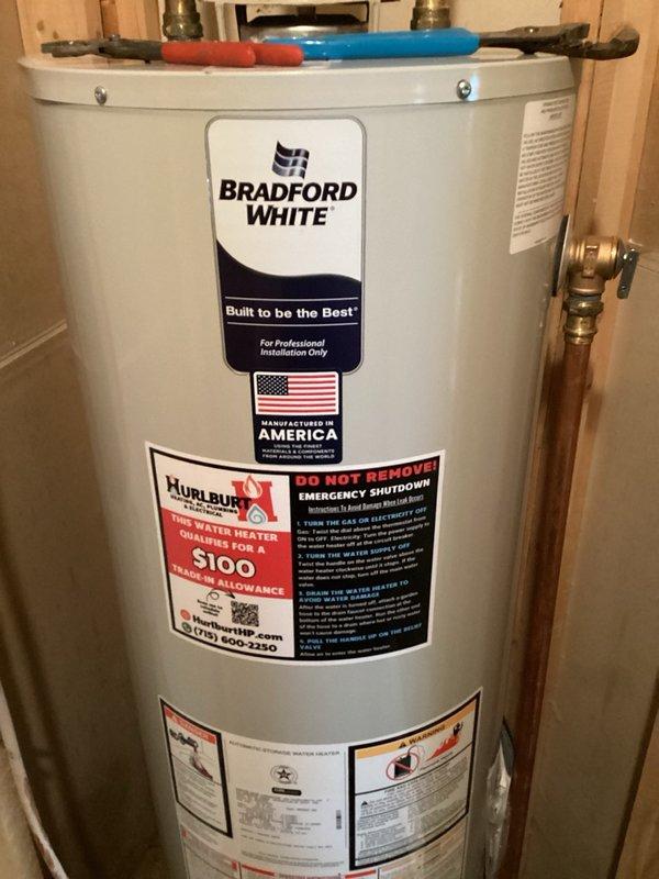 Replaced 40-gallon natural gas standard vent water heater with Bradford White unit in utility space, including all necessary pipe connections and fittings at top of tank. Repaired leaking bathroom sink by replacing vanity faucet and installing new shut-off valves under vanity to eliminate water infiltration into basement.