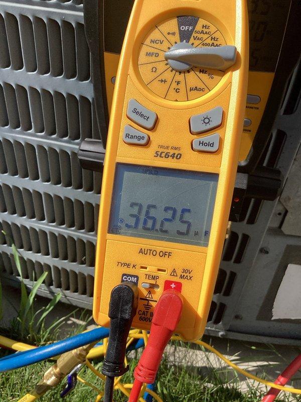 Completed AC maintenance visit on a 20 year-old system. Unit is currently cooling but found refrigerant levels low and capacitor reading out of acceptable range. Documented equipment make, model, and serial numbers with photographs per service agreement requirements. Advised customer that the out-of-range capacitor can lead to compressor failure and reduced system efficiency. Customer acknowledges system age and condition, opting to defer replacement until complete system failure occurs.