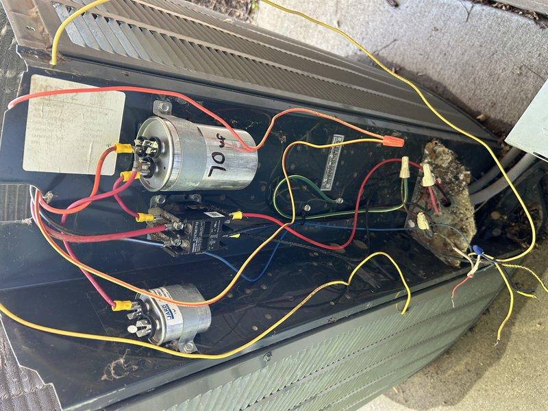 Responded to no cooling complaint on approximately 10-11 year old air conditioning unit. Upon inspection, discovered rodent damage to electrical wiring and failed capacitors. Replaced damaged wiring and capacitors, then performed system diagnostics. Testing revealed high pressure cut-out switch failed open, showing no continuity with unit off and equalized pressures at 200 PSI on both high and low sides. Provided estimate for high pressure switch replacement to restore unit operation.