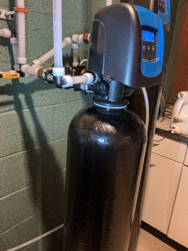 Responded to leak on previously installed water treatment system. Upon inspection, identified cracked drain adapters as source of leak. Shut down system to prevent further water damage and completed part order form for replacement drain adapters. System remains offline pending arrival and installation of replacement components under warranty coverage.