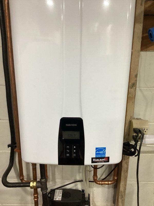 Responded to service call regarding intermittent gas odor detected near recently installed Navien tankless water heater. Performed thorough inspection of unit and all gas connections to identify potential leak or installation defect. Conducted operational test of water heater, verifying proper combustion, venting, and exhaust function. All gas connections tested and confirmed secure with no leaks detected. Unit operating within normal parameters with appropriate flame characteristics and exhaust discharge. Explained to customer that odor detected is normal exhaust smell from tankless water heater combustion process, particularly noticeable during initial break-in period and when unit cycles on. Confirmed proper installation of venting system and adequate clearances around exhaust termination. No safety concerns identified. Unit functioning as designed.