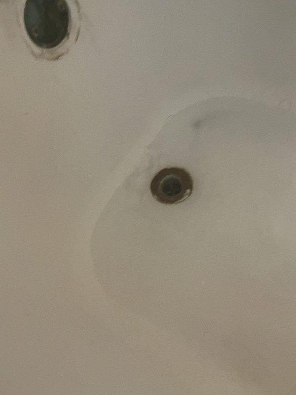 Responded to a residential plumbing service call for a clogged shower drain backup combined with a biannual plumbing inspection. Upon diagnostic evaluation, determined the tub drain was blocked with an accumulation of hair causing slow drainage and standing water.

Cabled the tub drain line using appropriate drain cleaning equipment and successfully extracted a large hair ball obstruction from the drain system. Thoroughly cleaned the tub area and performed water flow testing to verify proper drainage was restored. The drain was flowing freely with no backup at completion.

Conducted comprehensive biannual plumbing inspection including examination of water heater, washing machine connections, laundry hoses, and leak detection throughout the accessible plumbing system. During water heater inspection, observed significant corrosion present on the water heater drain valve. Made the decision not to perform standard drain flush procedure due to risk of inducing leaks from the corroded drain 