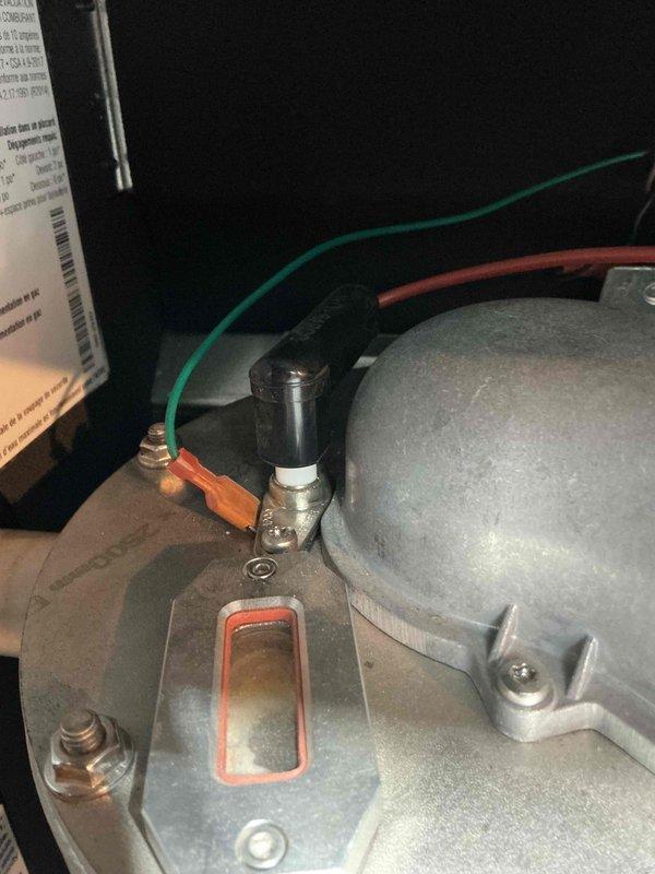 Responded to service call for boiler making abnormal noise during operation. Upon arrival, activated system and observed vibration-type noise with flame rollback that stabilized after brief runtime. Performed comprehensive diagnostics including combustion analysis and gas valve testing, which confirmed proper operation of both components. Consulted with technical support regarding intermittent noise issue that has persisted since installation seven years ago. Based on technical recommendation and diagnostic findings, upgraded single-prong igniter to dual-prong igniter assembly to resolve ignition stability and noise concerns. System tested successfully following igniter replacement with normal operation confirmed. Documented conditions with photos for service records.
