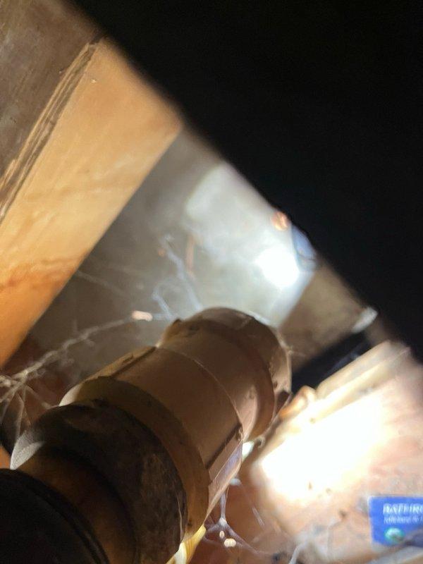 Responded to return visit for non-functional sump pump system with active alarm condition. Upon arrival, diagnosed battery backup system experiencing rapid power drainage after disconnection from charger. Testing confirmed battery charger maintained charge during operation but battery failed to retain adequate voltage when isolated from power source. Inspected primary sump pump assembly with dual brass valve configuration and associated piping connections in basement utility area. Evaluated electrical connections and backup power components. Documented equipment condition through photography for diagnostic purposes. Provided quotation for replacement battery and battery charger assembly to restore proper backup system functionality and resolve alarm condition.