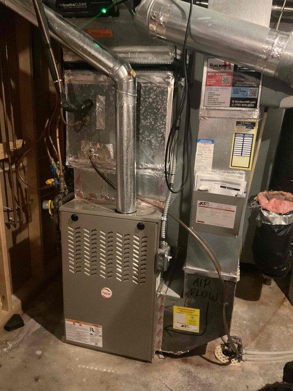 Completed comprehensive furnace tune-up and maintenance on 4-year-old Payne system to prepare unit for fall heating season. Performed full inspection of furnace, air handler, and associated components including heat exchanger examination, burner assembly cleaning, blower motor inspection, and verification of all electrical connections and safety controls. Addressed customer concern regarding air conditioning inadequacy during peak afternoon heat, with thermostat set at 70°F but indoor temperatures rising to 76°F; noted system cools effectively during evening hours, indicating possible capacity limitations during extreme heat conditions or potential airflow restrictions. Inspected ductwork connections, refrigerant lines, and airflow pathways throughout system. All components found operating within normal parameters with no immediate safety concerns or mechanical deficiencies identified. System tested and confirmed operational for upcoming heating season.