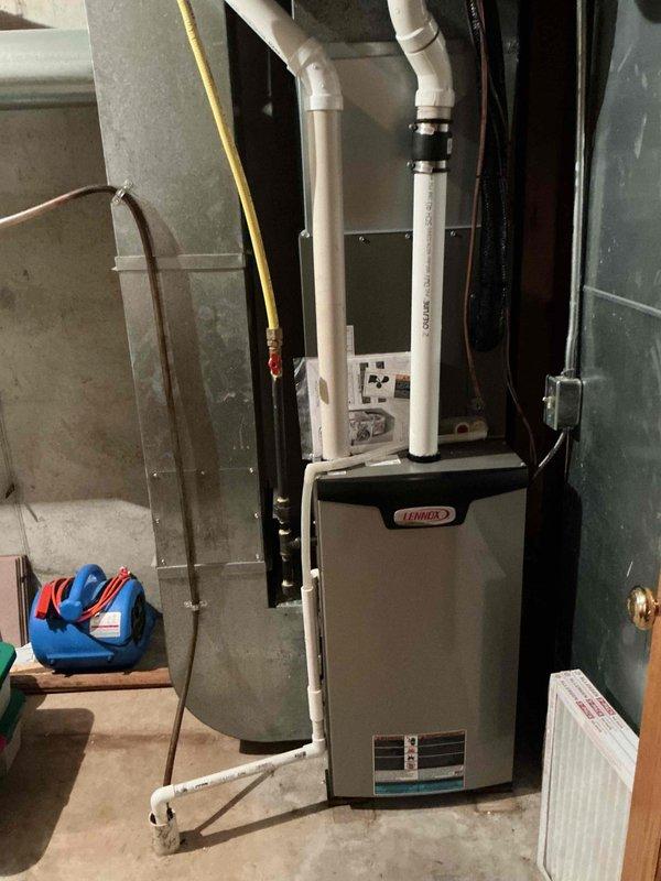 Performed comprehensive AC tune-up on residential cooling system. Removed exterior panels and rinsed condenser coil, inspected all electrical components with capacitor testing within specification, and verified system cleanliness. Proceeded to indoor unit where recently replaced filter was confirmed, checked blower speeds and wheel for proper operation and cleanliness, and cleared evaporator coil drain line. System startup confirmed proper operation with 20-degree temperature differential across coil, indicating optimal performance with no deficiencies noted.