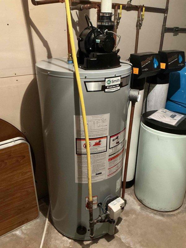 Performed comprehensive AC tune-up on residential cooling system. Removed exterior panels and rinsed condenser coil, inspected all electrical components with capacitor testing within specification, and verified system cleanliness. Proceeded to indoor unit where recently replaced filter was confirmed, checked blower speeds and wheel for proper operation and cleanliness, and cleared evaporator coil drain line. System startup confirmed proper operation with 20-degree temperature differential across coil, indicating optimal performance with no deficiencies noted.