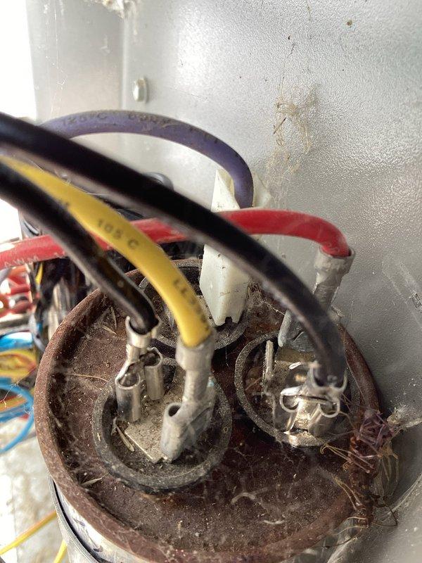 Responded to no cooling call on residential air conditioning system. Upon arrival, found unit completely non-operational with no power to outdoor condenser. Inspection revealed severely corroded and deteriorated electrical connections at terminal block, with visible signs of arcing and heat damage. Cleaned corroded terminals, replaced damaged wire connections, and restored power to unit. System tested and confirmed operational with proper cooling function restored.