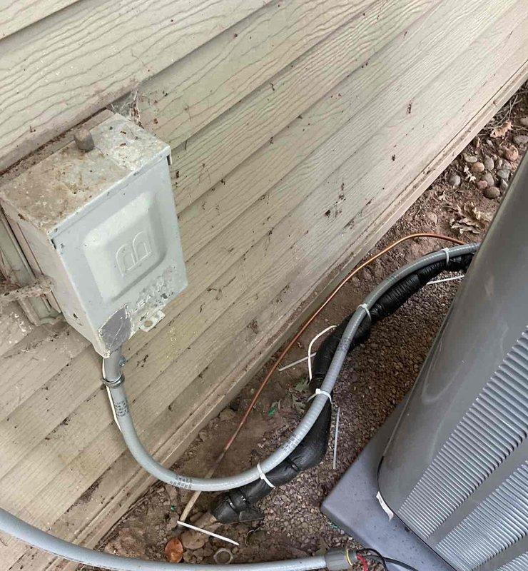 Completed final inspection and code corrections for newly installed 4-ton, 14.5 SEER2 single-stage air conditioning system with matching cased coil and factory-installed TXV valve. Installed new electrical whip to outdoor condensing unit with proper conduit routing and wall-mounted disconnect, verified all electrical connections at panel and equipment, and installed code-compliant strapping at furnace for refrigerant line support. All components inspected, tested, and confirmed operational per manufacturer specifications and local electrical codes.