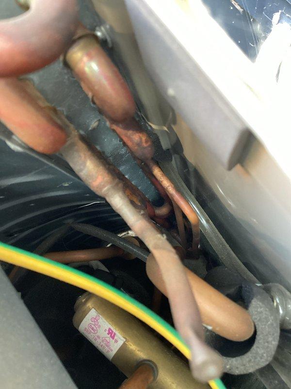 Responded to callback for mini split system not cooling after refrigerant was added during previous service visit. Upon inspection, determined that refrigerant charge only lasted approximately one day, indicating active leak in system. Performed thorough leak detection on both outdoor and indoor unit components, including inspection of copper refrigerant lines, coil assemblies, and connection points. Diagnostics confirmed refrigerant leak is located within the indoor evaporator unit based on rapid loss of charge and visual inspection findings. Provided customer with repair estimate for leak repair and system recharge as backup option while they contact original installing contractor regarding warranty coverage.