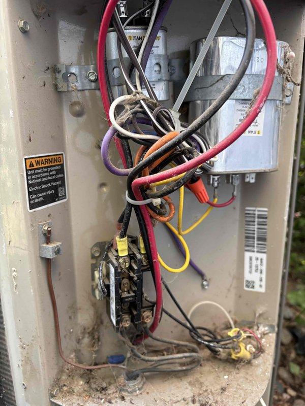 Responded to no cooling complaint with reported system freezing and water leakage. Upon arrival, performed comprehensive diagnostic evaluation of HVAC system. Verified thermostat operation and settings, confirmed proper system communication. Inspected air filter for restrictions, found acceptable airflow. Tested blower motor operation and verified proper functionality. Conducted outdoor condensing unit inspection and assessed overall system performance.

Performed refrigerant charge analysis on R-22 system and discovered critically low refrigerant levels. Diagnosis confirmed refrigerant leak in system causing insufficient charge, resulting in evaporator coil freezing and subsequent ice buildup with water leakage. Low refrigerant condition prevented proper heat absorption and caused coil temperatures to drop below freezing point.

System age determined to be approximately 24 years old, utilizing R-22 refrigerant which has been phased out under EPA regulations. Given the combination of r