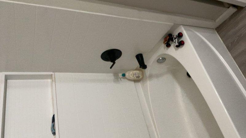 Completed comprehensive plumbing inspection for residential property sale, evaluating all faucets, fixtures, pipes, drains, toilets, and shut-off valves throughout the home. Inspected half bath and full bath for proper toilet function, seal integrity, and flush mechanisms, with specific attention to upstairs laundry closet area for potential leak concerns and adequate shut-off valve accessibility. Verified kitchen plumbing system functionality, exterior hose bib operation, and documented all findings with photographic evidence of bathroom fixtures and components.