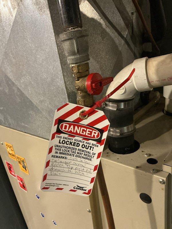 Responded to no cooling complaint on 31-year-old air conditioning system. Upon inspection, found failed condenser fan motor and failing capacitor with 5-7 day lead time on replacement parts. System utilizes obsolete refrigerant with potential for additional underlying issues. During evaluation, discovered cracked heat exchanger in EnviroPlus80 Comfortmaker furnace located in top right cell through high limit switch eyelet, causing carbon monoxide leakage outside unit during operation. Immediately red-tagged furnace as unsafe to operate and applied lockout/tagout procedures to gas supply valve. Documented critical safety hazard with photographic evidence. Scheduled same-day estimate appointment for new air conditioning system and provided options for complete HVAC system replacement given age of equipment and severity of safety concerns. Replaced condenser fan motor, heat exchanger, and complete air conditioning system to restore safe, efficient operation.
