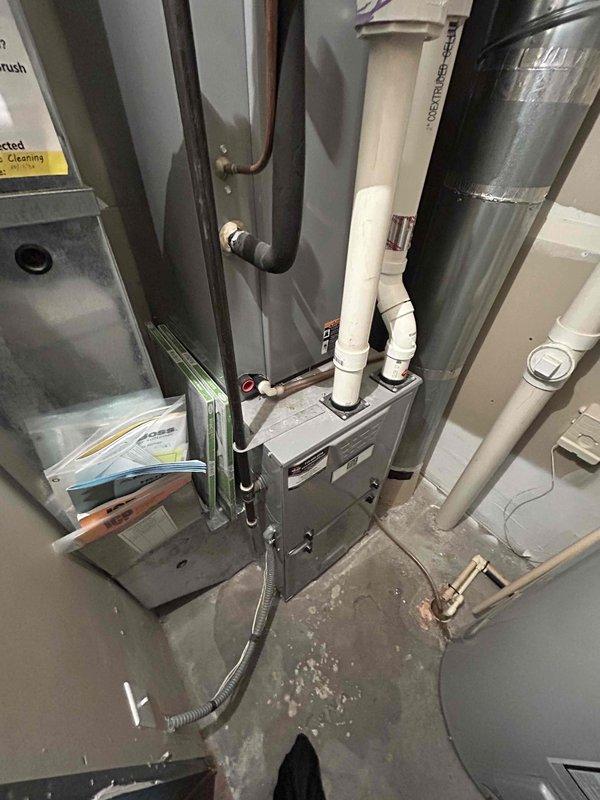 Completed annual cooling maintenance and AC tune-up on residential split system with no reported issues. Performed comprehensive inspection of indoor air handler unit in basement mechanical room and outdoor condenser unit, including evaluation of refrigerant levels, electrical connections, condensate drainage system, ductwork connections, and overall system operation. All components found to be functioning within normal parameters and system left in proper working condition.