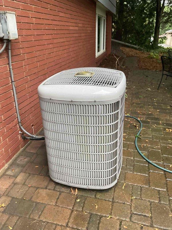 Responded to service call for water leaking around gas furnace that had been occurring for three weeks. Upon diagnosis, found evaporator coil freezing up due to low refrigerant levels in the cooling system. Given the age of the unit and extent of refrigerant loss, recommended and completed full system replacement rather than repair to ensure reliable long-term operation and prevent recurring issues.