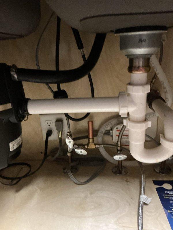 Installed new brushed stainless steel kitchen faucet with high arched spout at single-family residence. Connected faucet supply lines to existing shutoff valves and verified proper water flow and drainage through double-basin stainless steel sink. Cleared basement toilet obstruction using closet auger, restoring proper flush function and drainage.