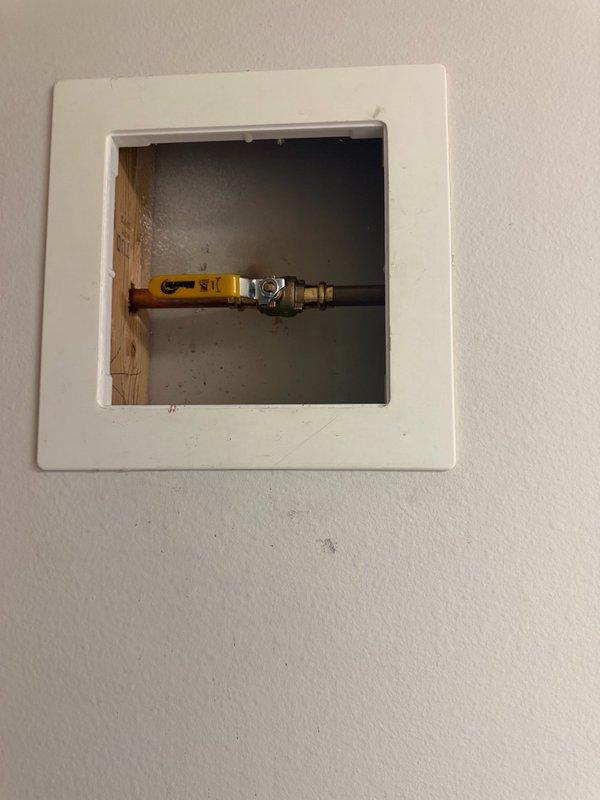 Replaced failed exterior hose bib with new brass frost-free spigot assembly mounted to vinyl siding. During installation, discovered kitchen sink basket strainer had developed a minor leak and replaced it along with installing a new kitchen faucet. All fixtures tested and verified operational with no leaks detected.