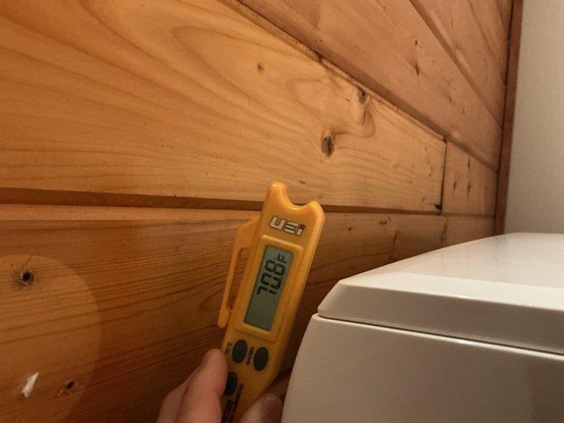 Responded to callback regarding insufficient cooling in living room area serviced by mini-split system and concerns about previous maintenance visit. Performed comprehensive system inspection on one-year-old AC system with attic-mounted air handler and mini-split head unit. Inspected and verified air handler and air filters in good condition. Examined outdoor unit condenser coil, found clean with minor cosmetic dent but no refrigerant leakage or residue present. Cleaned and inspected mini-split air filters and blower wheel. Measured temperature differential on both systems, recording 21-22°F delta-T, confirming proper operation within manufacturer specifications. Advised customer that living room's high ceilings and lack of insulation contribute to cooling challenges during peak temperatures in the 80-90°F range. Both systems operating correctly with no mechanical deficiencies identified. Customer instructed to monitor performance during extreme heat conditions and contact if issues pe