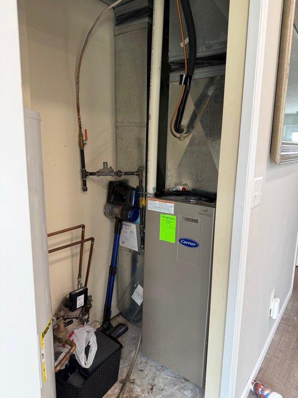 Performed comprehensive AC inspection on 20-year-old Carrier system prior to property closing. Identified multiple critical failures including cracked heat exchanger, oil-leaking blower motor, failed dual capacitor, and pitted contactor. Replaced heat exchanger, blower motor, dual run capacitor, and contactor to restore system to safe operating condition. Documented all findings with photographs and recommended comfort advisor consultation for long-term system planning given age of equipment.
