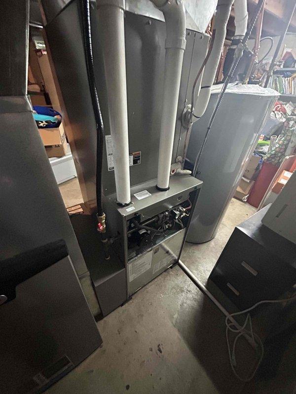Completed annual AC tune-up on 1-year-old furnace replacement system as part of maintenance agreement. Performed comprehensive inspection per standard maintenance form, verified all components operating within normal parameters, and documented equipment condition with photos.