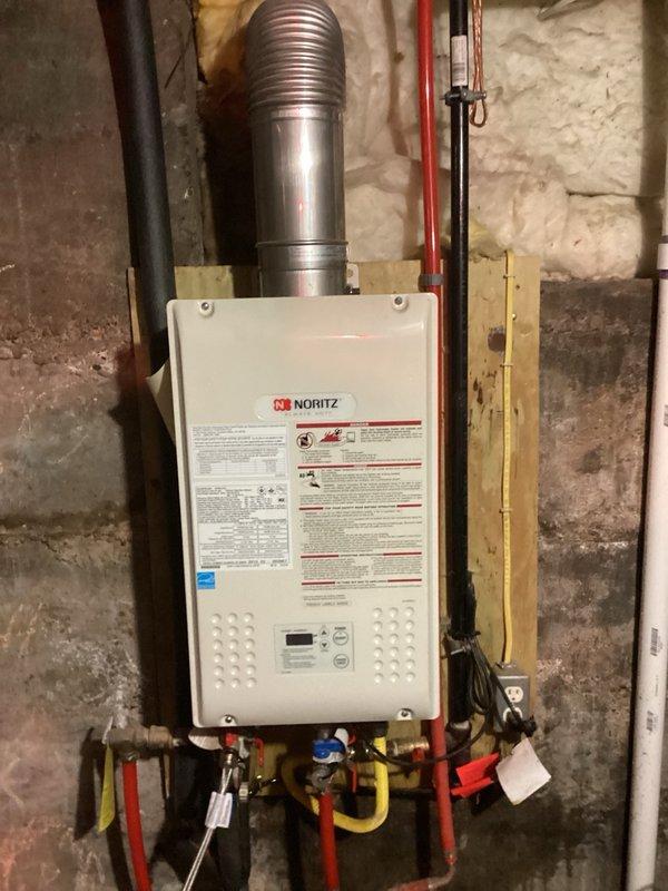 Performed routine maintenance flush on a Noritz NR98-OVC direct vent tankless water heater unit. Completed descaling and flushing procedure to remove mineral buildup and ensure optimal performance and efficiency. Verified all connections, gas pressure specifications, and water supply pressure remained within manufacturer guidelines upon completion.