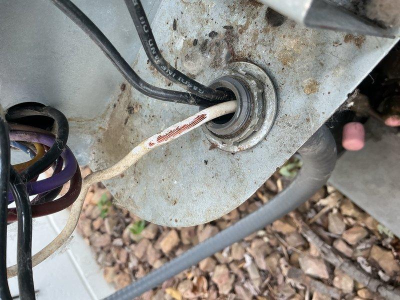 Responded to no-cool complaint on 6-year-old system for second opinion after another company reported rodent damage and low refrigerant. Upon arrival, thermostat was at setpoint of 72°F. Performed comprehensive system evaluation including air filter inspection, blower motor operation, outdoor unit coil condition, capacitor, contactor, and refrigerant charge verification. Located wire damage from rodent activity at outdoor unit; confirmed damage was limited to protective sleeve only with conductors intact. Secured exposed wiring with electrical tape. Measured supply/return air temperature delta at 19°F, confirming proper system performance. All components operating within normal parameters with no refrigerant loss detected. Explained that previous temperature issues likely resulted from extreme outdoor conditions (90°F+), heat gain from kitchen activities, and inadequate ductwork coverage to home addition near thermostat location rather than equipment malfunction. System operating prope