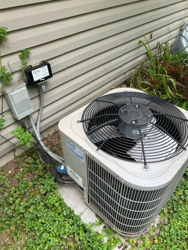 Responded to no cooling complaint and found outdoor condensing unit humming but not operating. Diagnosed and replaced failed capacitor, restoring unit operation. Upon further evaluation, discovered system achieving only 10-degree temperature split and determined refrigerant charge was low on R-410A. Advised customer of refrigerant leak requiring repair and provided recommendations for leak detection service and system replacement options given age of equipment. Unit left operational but requiring future leak repair to restore full cooling capacity.