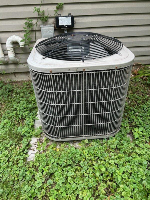 Responded to no cooling complaint and found outdoor condensing unit humming but not operating. Diagnosed and replaced failed capacitor, restoring unit operation. Upon further evaluation, discovered system achieving only 10-degree temperature split and determined refrigerant charge was low on R-410A. Advised customer of refrigerant leak requiring repair and provided recommendations for leak detection service and system replacement options given age of equipment. Unit left operational but requiring future leak repair to restore full cooling capacity.