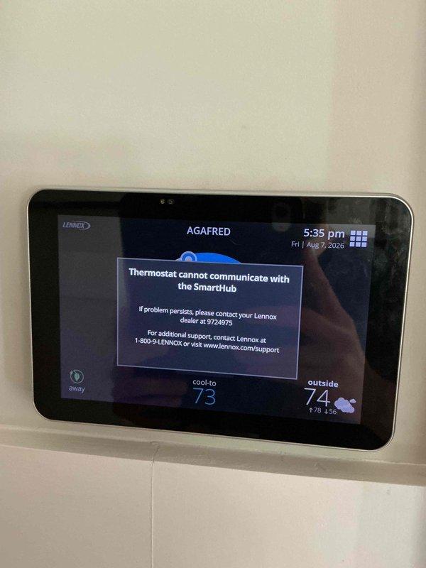Replaced existing thermostat with new Lennox S40 smart thermostat connected to SmartHub system under full warranty coverage. Initial installation completed with thermostat mounted and wired to control board, however communication error detected between thermostat and SmartHub requiring troubleshooting and rescheduling. Assisted with initial setup and programming of temperature settings, left equipment on-site for completion of SmartHub connectivity during follow-up appointment.