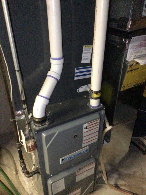Responded to scheduled maintenance appointment and discovered heating system would not activate. Diagnosed faulty inducer motor on Daikin furnace with binding shaft that required manual starting to operate. Cleared all pressure switch ports and hoses, confirmed no obstructions present. Recommended inducer motor replacement before heating season due to intermittent failure risk. Performed complete air conditioning tune-up including condenser coil washing and comprehensive electrical testing. All AC electrical measurements within manufacturer specifications. System operational at departure with advisement provided.