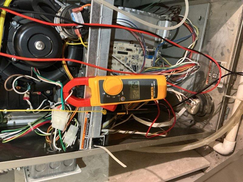 Completed annual heating and cooling maintenance on 12-year-old Payne HVAC system utilizing R-410A refrigerant. On furnace, scrubbed burners and flame sensor, inspected heat exchanger with no defects found, verified capacitor, blower motor, control board, and all wiring connections in proper working condition. Confirmed CO levels within safe parameters and measured supply air temperature delta at 53 degrees, indicating optimal heating performance. Replaced air filter and confirmed unit ready for winter operation. On air conditioning system, inspected outdoor unit capacitor, contactor, and refrigerant charge—all within manufacturer specifications. Rinsed condenser coils to remove debris, verified 19-degree temperature split across evaporator coil, and confirmed condensation drain line flowing freely. Both systems operating efficiently with no issues identified.