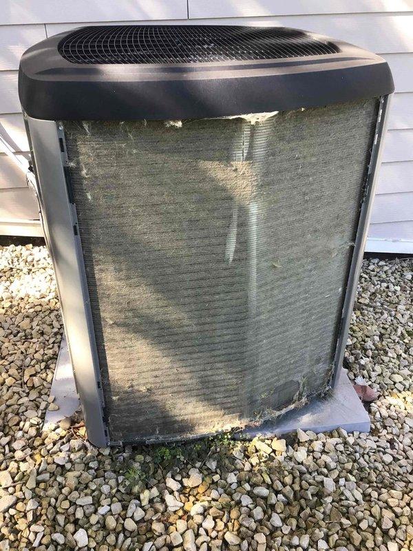Completed routine air conditioning maintenance tune-up on outdoor condensing unit. Performed thorough washing of exterior coils to remove accumulated dirt, algae, and organic debris buildup. Conducted electrical system inspection with all connections found secure and operational. Inspected indoor air filter and advised replacement needed. Performed operational test with system running properly and cooling effectively.