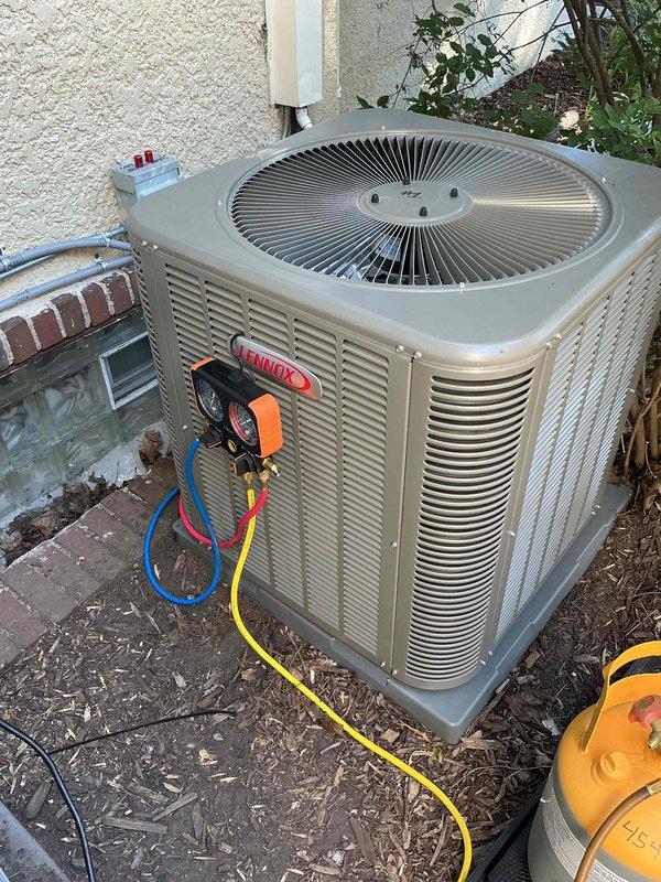 Responded to a callback on a Lennox system installed two days prior with no cooling and freezing conditions. Diagnosed low airflow and excessive high-side pressure due to refrigerant overcharge. Recovered refrigerant from system, performed evacuation to remove moisture and non-condensables, then recharged unit to manufacturer specifications. System restored to proper operation with correct pressures and airflow.