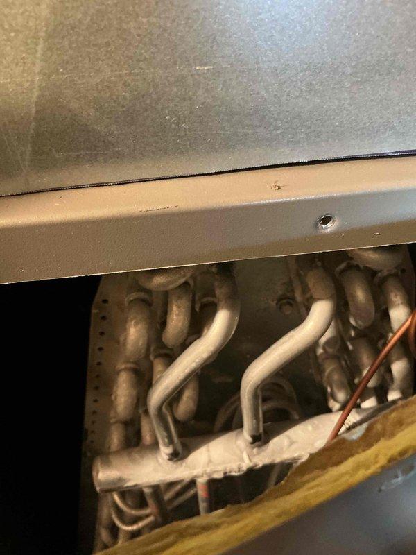Responded to no cool call on AC system installed in October 2022. Upon arrival, found system operational but experiencing high indoor humidity levels. Determined thermostat fan setting was configured to run continuously, preventing proper dehumidification during cooling cycles. Adjusted thermostat fan setting from "ON" to "AUTO" mode to allow for adequate moisture removal between cycles. Advised customer to operate basement dehumidifier to supplement whole-home humidity control. System cooling capacity verified within normal operating parameters.