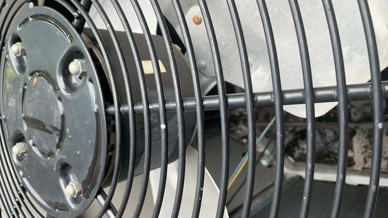 Responded to a non-operational outdoor condensing unit and diagnosed a failed condenser fan motor. Replaced the defective PSC motor (825/1075 RPM) with a new standard unit, restoring proper airflow and system operation. Verified unit functionality upon completion with all components running within normal parameters.