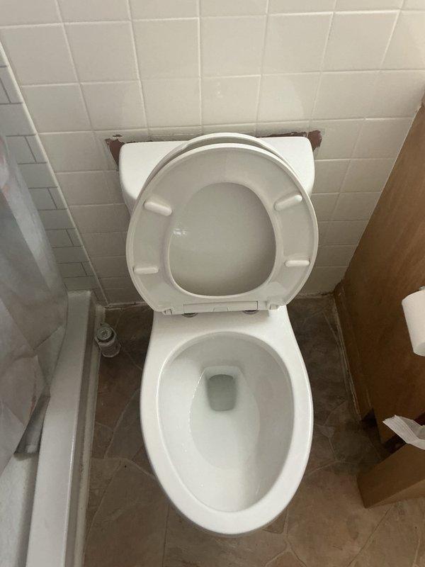 Removed and replaced existing broken toilet with customer-supplied unit. The property had only one toilet in service, requiring prompt replacement to restore functionality. Disconnected water supply line, unbolted and removed damaged fixture from floor flange, and cleaned mounting surface. Installed new wax ring seal, positioned customer-provided toilet onto flange, secured with closet bolts, and reconnected water supply. Tested for proper operation and verified no leaks at supply connection or base seal.