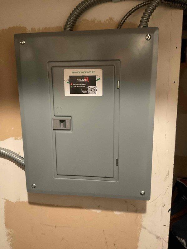 Responded to phone follow-up regarding water accumulation in HVAC drain pan. Inspected unit interior components, control board, wiring connections, and drainage system. Documented current system condition with photos of electrical panel and internal components for customer records and provided technical guidance to address drainage concern.